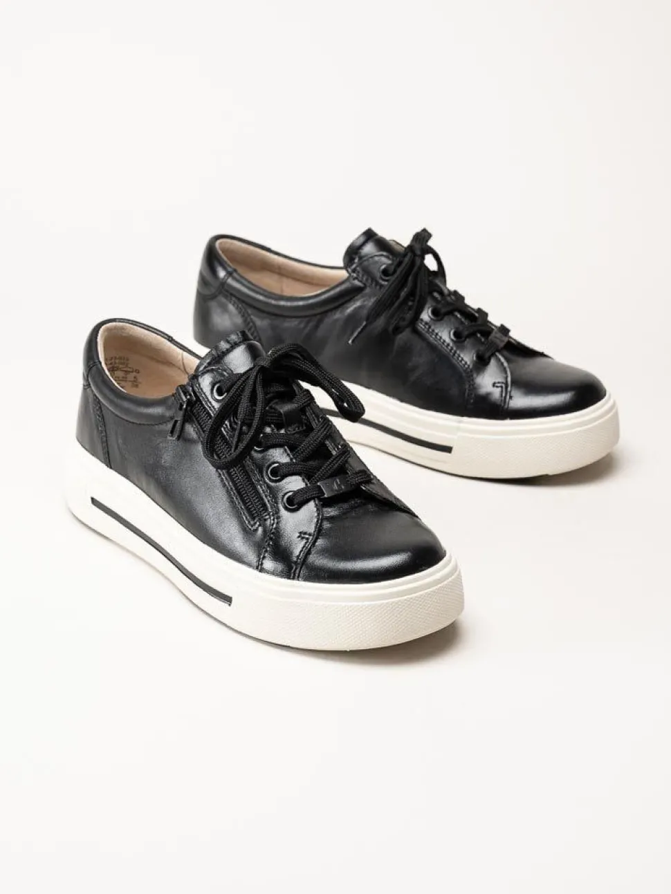 Caprice - Svarta platåsneakers i skinn