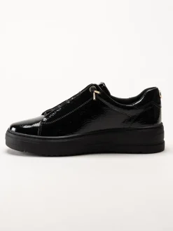 Marco Tozzi - Svarta sneakers i syntetlack med gulddetaljer