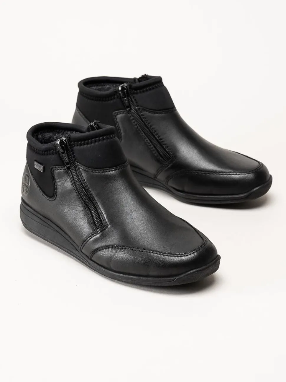 Rieker - Svarta boots i skinn och textil