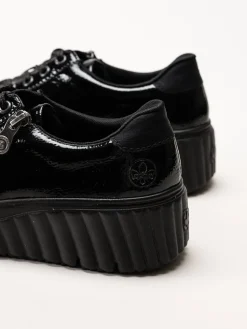 Rieker - Svarta platåsneakers i skinn-lack